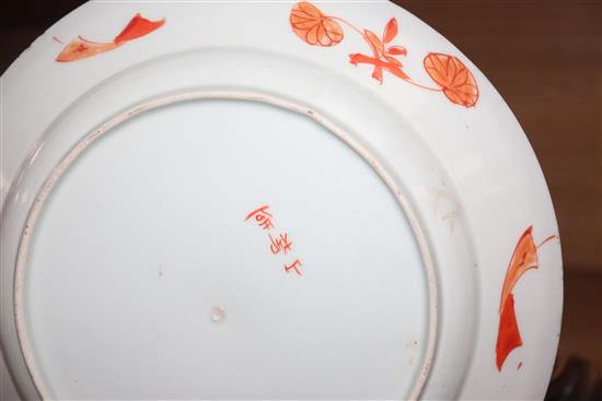 A Chinese porcelain bowl, decorated with figures in reserves on an iron red ground and two other items,